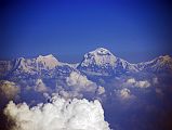 Rolwaling 00 01 Dhaulagiri V, III, II, Dhaulagiri I, and Tukuche Peak On Flight To Kathmandu The early morning flight from Doha to Kathmandu became a mountain flight as we passed Dhaulagiri. To the left of Dhaulagiri are Dhaulagiri V, Dhaulagiri III, and Dhaulagiri II. To the right of Dhaulagiri is Tukuche Peak.